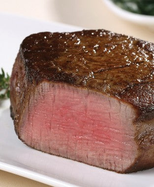 Cooked USDA Prime Center-Cut Filet Mignon from New York Prime Beef with seared crust and tender center.