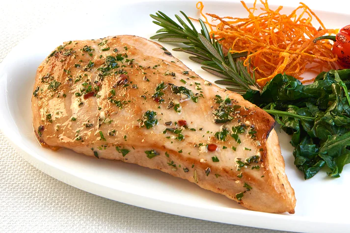 Juicy boneless skinless chicken breast from New York Prime Beef, perfectly cooked and served with fresh vegetables for a healthy high-protein meal