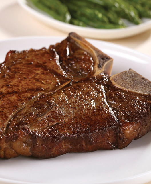 Dry aged USDA Prime T-Bone steak from New York Prime Beef, cooked and shown in vertical presentation