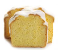 Sweet Sam’s Iced Lemon Pound Cake from the sampler pack, golden loaf topped with tangy lemon icing and zest