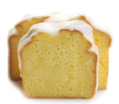 Sweet Sam’s Iced Lemon Pound Cake from New York Prime Beef, sliced to reveal moist golden crumb with tangy lemon icing and zest